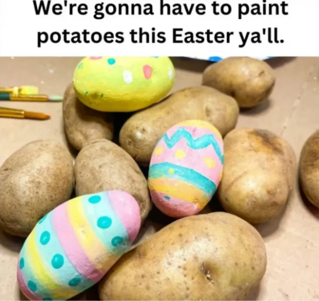 A pile of potatoes sits on a brown surface, some of which are painted to resemble Easter eggs with colorful patterns like…