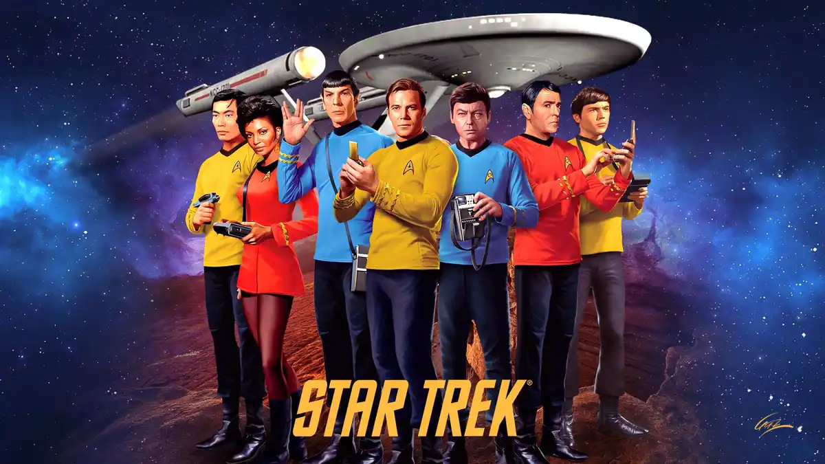 The image shows the original Star Trek cast standing on a rocky planet with a starfield and nebula behind them, the USS…