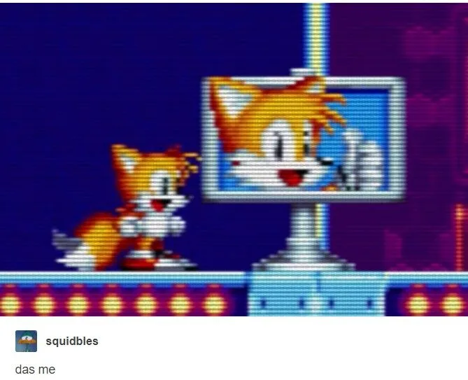 A pixelated image from a Sonic the Hedgehog game shows Tails looking at a TV screen displaying a distorted, glitched version…