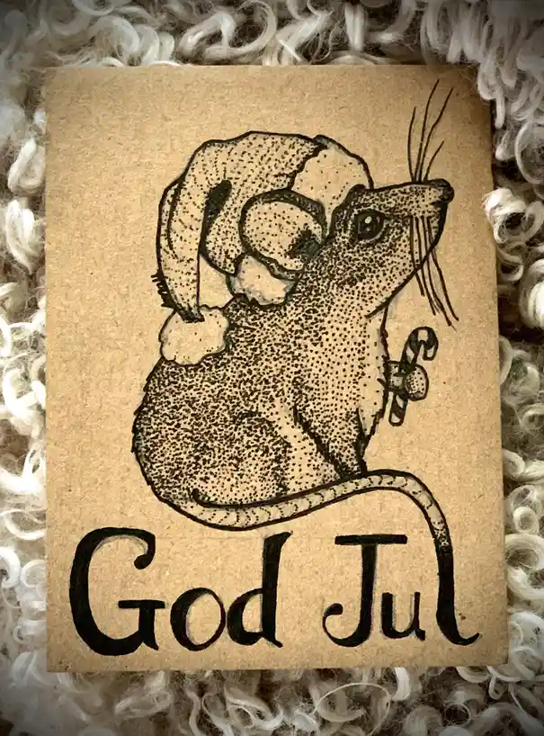A hand-drawn dot-art illustration on brown paper depicts a mouse wearing a Santa hat and holding a candy cane, with the text…