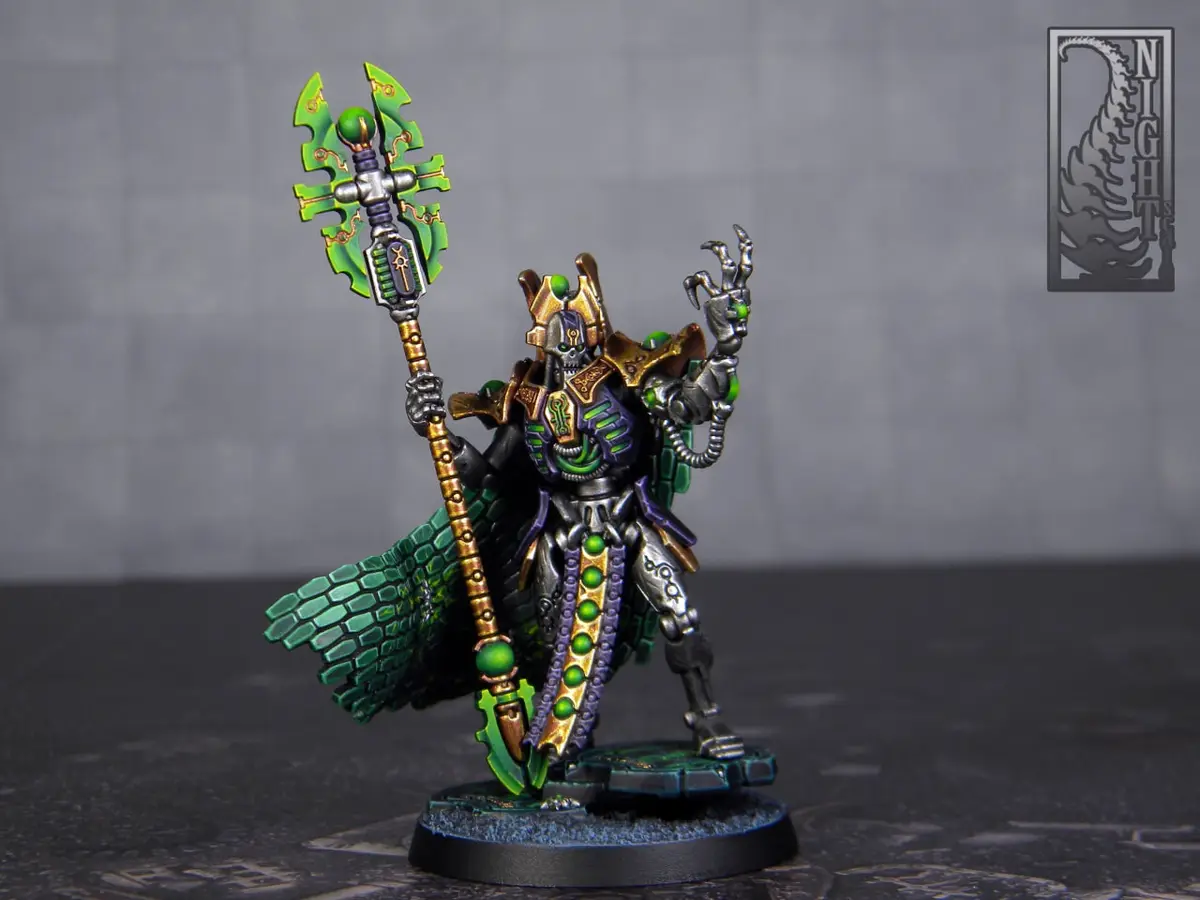 A highly detailed, painted miniature of a green-skinned, armored warrior with a large, ornate green and gold staff, standing…