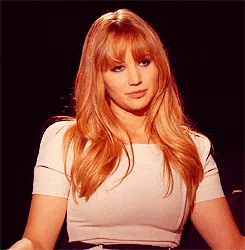 A grid of six identical photos shows a woman with long blonde hair and bangs wearing a white short-sleeved top against a…