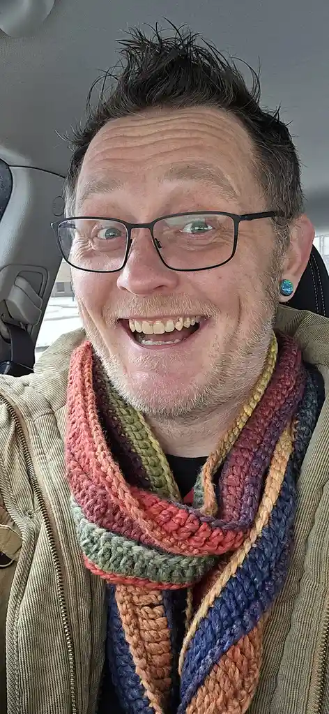 Rocking my cozy, handmade Christmas scarf with pride!
