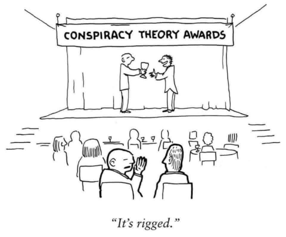 A black-and-white cartoon depicts a stage with a banner reading 'CONSPIRACY THEORY AWARDS' where two men in suits toast with…