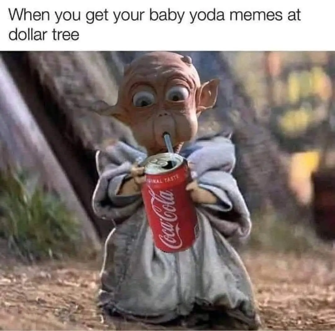A small, bald, green-skinned creature resembling Baby Yoda is shown drinking from a red Coca-Cola can using a straw. The…