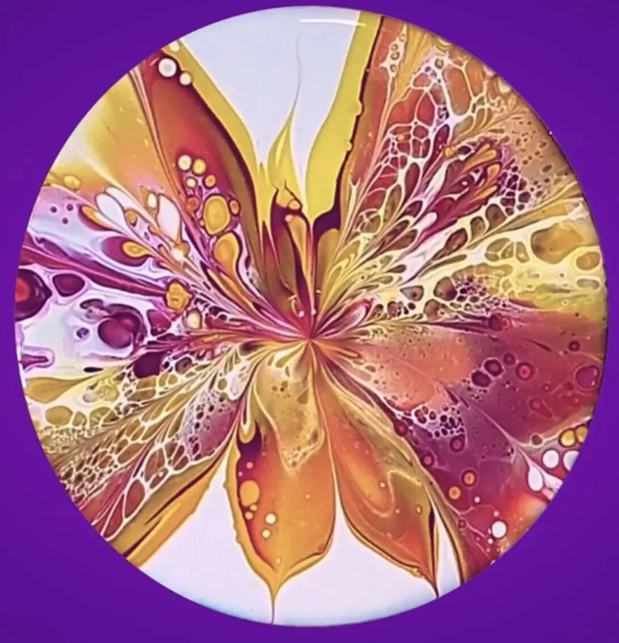 A circular abstract painting resembling a butterfly with swirling gold, orange, and purple patterns on a purple background…