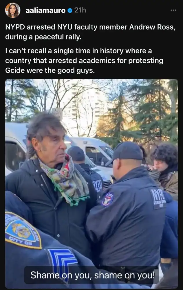 An older man with a colorful scarf is being detained by NYPD officers during a protest. The image is overlaid with text from…