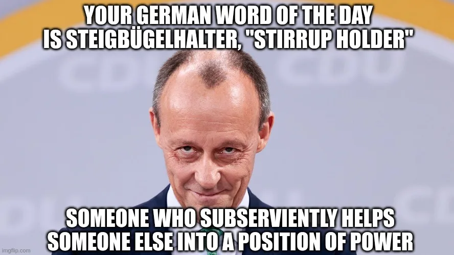A man in a suit with a smug, knowing expression looks at the camera. The text above him reads 'YOUR GERMAN WORD OF THE DAY…