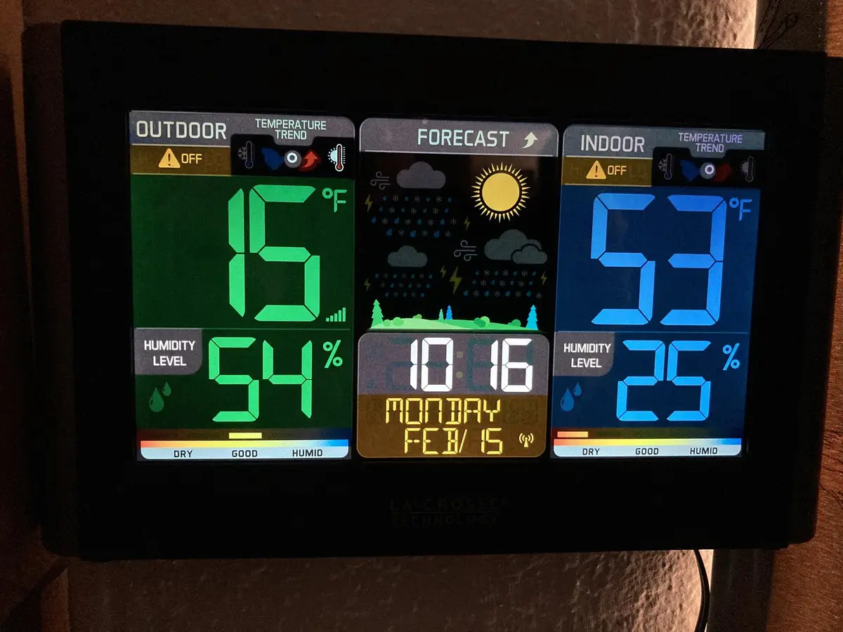 A digital weather station displays outdoor temperature at 15°F with 54% humidity and indoor temperature at 53°F with 25%…