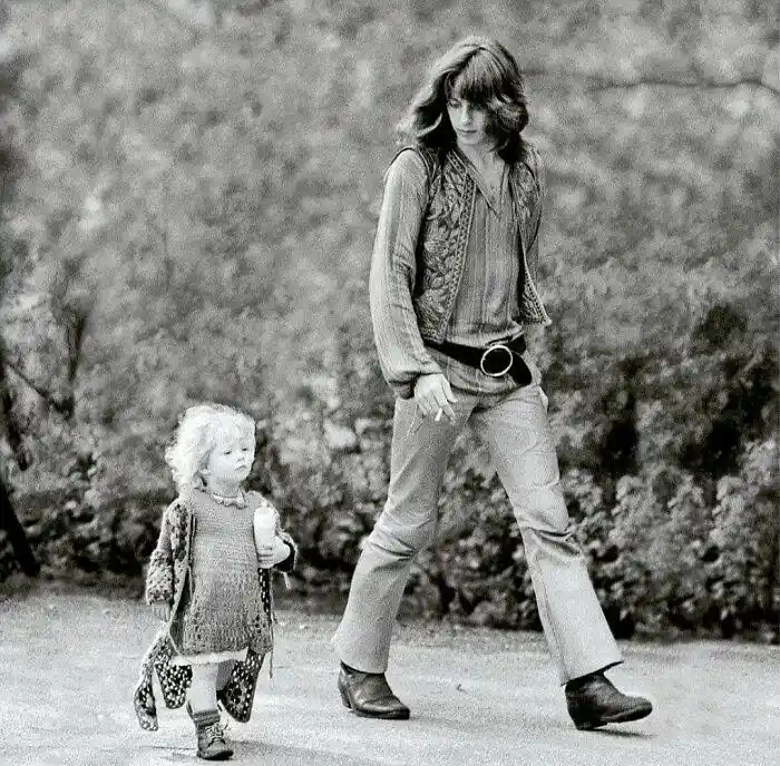 A Groovy Moment: Hippie Dad and Daughter Stroll in 1968 Amsterdam