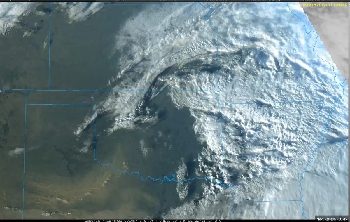 a satellite image from the GOES-16 weather satellite shows a large, swirling storm system over the midwestern United States…