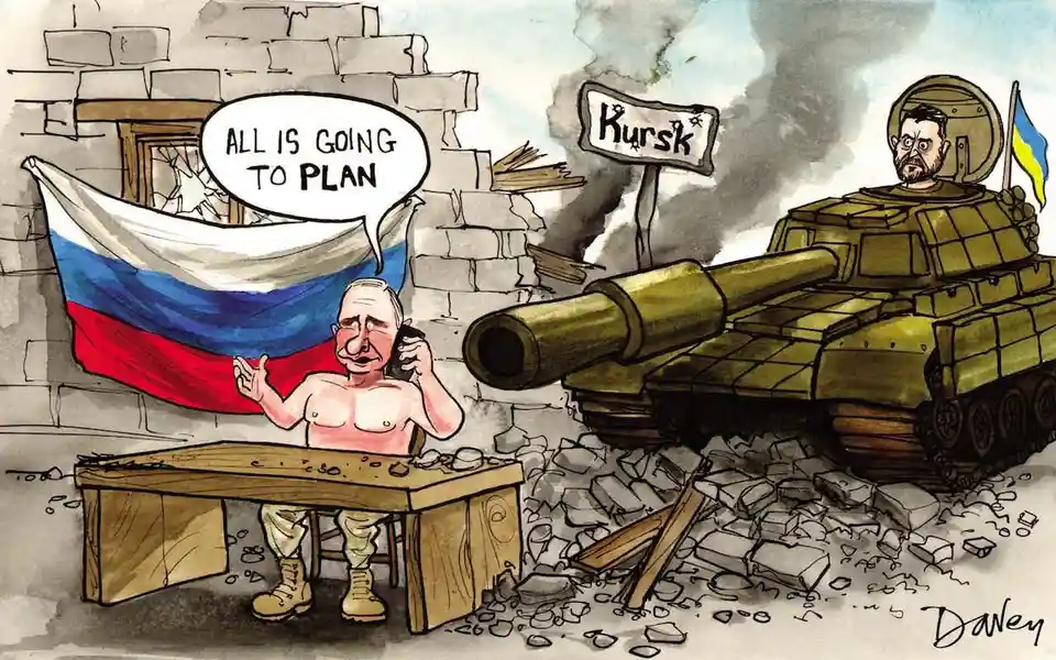 A cartoon depicts a shirtless Vladimir Putin sitting at a wooden desk in a ruined building with a Russian flag behind him…