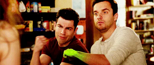 A split-screen image shows two men in a store, one wearing a green glove and the other not. The man with the glove makes a…
