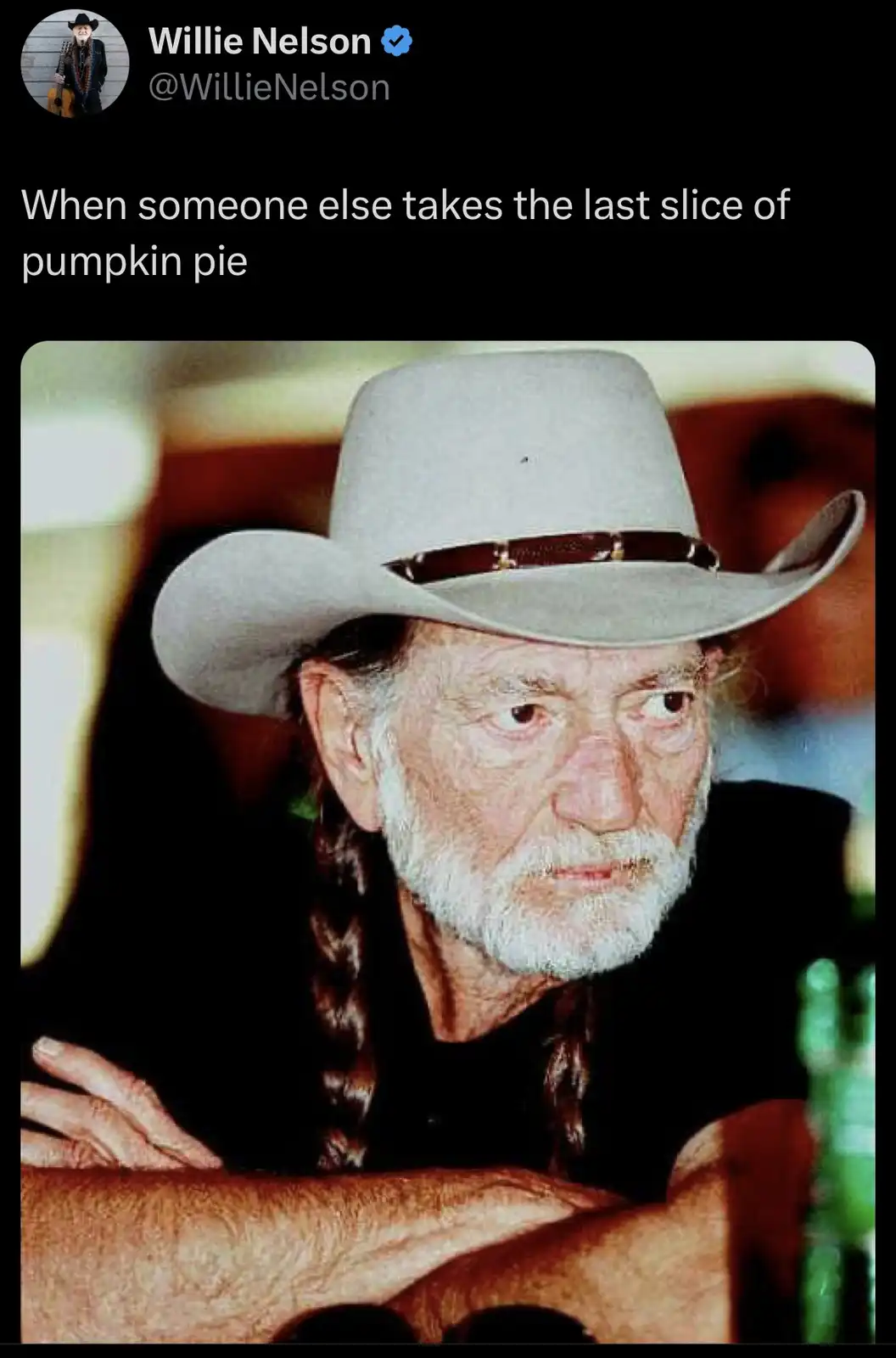 A screenshot of a tweet from verified account Willie Nelson (@WillieNelson) shows a photo of the country music icon with a…