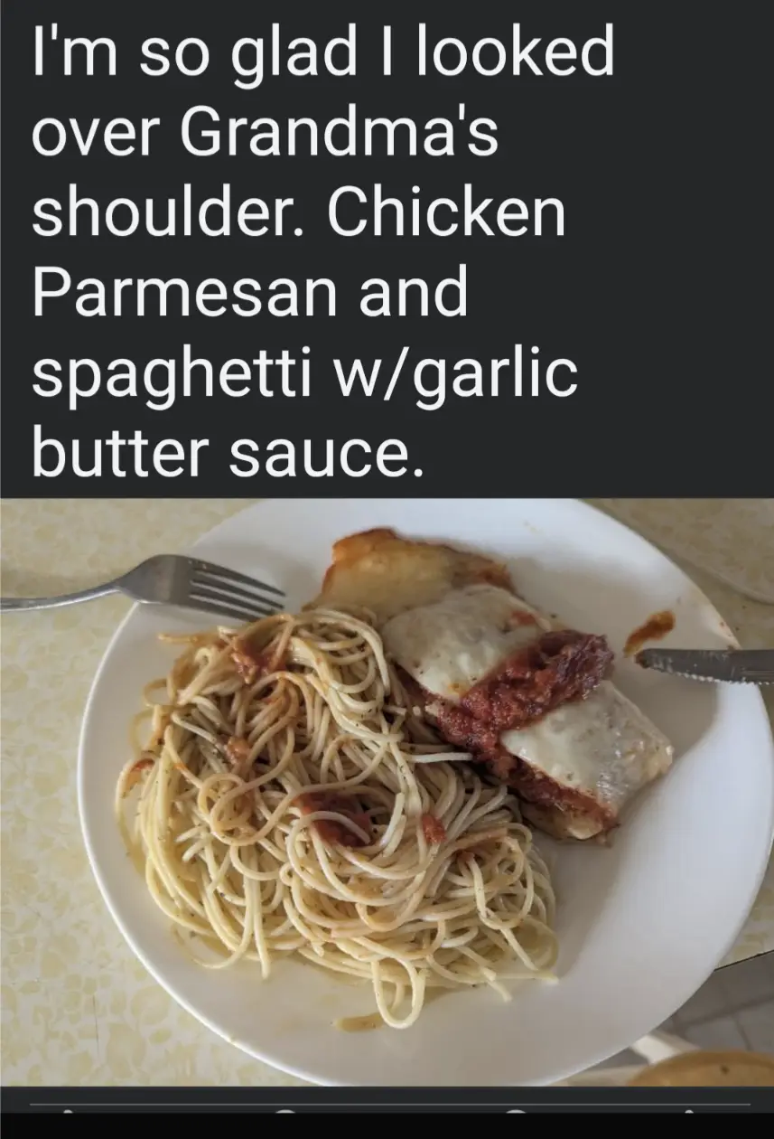 A white plate holds a serving of spaghetti with a light garlic butter sauce alongside a piece of chicken parmesan topped…