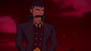 An animated man with a dark mustache, wearing a dark coat over a yellow vest, stands against a red sky. The overlaid text…