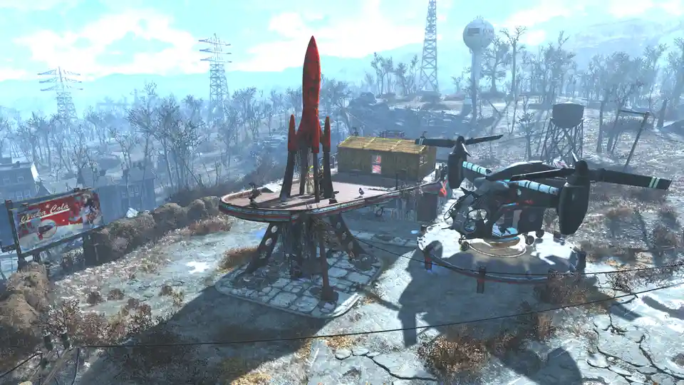 A screenshot from the video game Fallout 4 shows a dilapidated, post-apocalyptic landscape with a rusted red rocket and a…