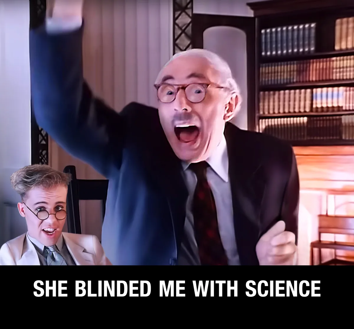 An image shows two men in suits, one older with glasses shouting excitedly with his arm raised, while a younger man in a…