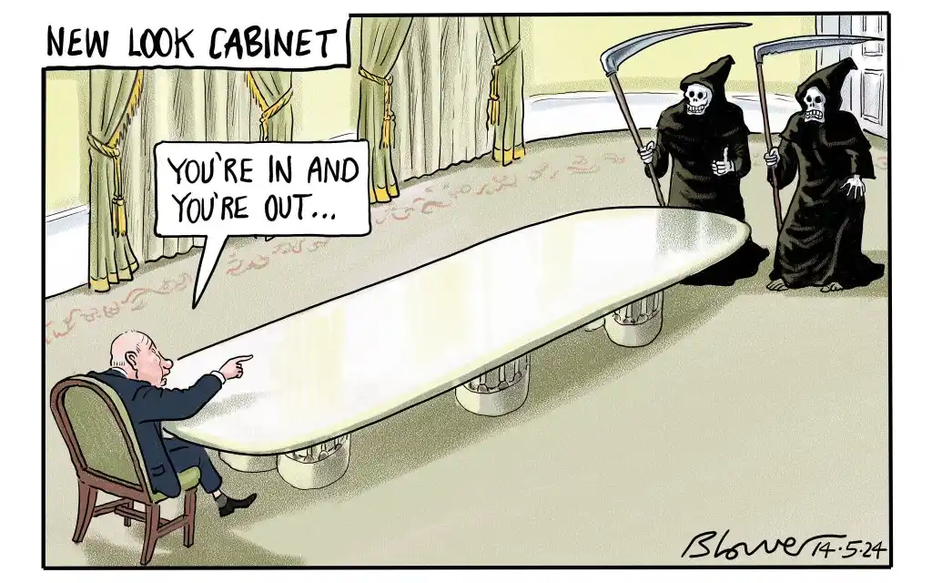 A cartoon depicts a man in a suit sitting at a long table, pointing at two grim reapers standing behind him holding scythes…