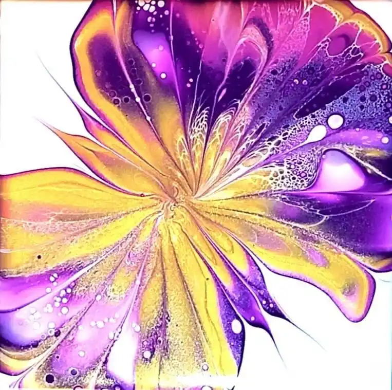 A vibrant abstract image resembling a flower with swirling petals in shades of purple, yellow, and gold, featuring…