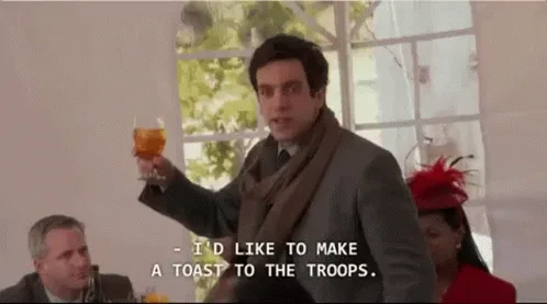 A composite image from the movie 'The Proposal' shows a man making a toast at a dinner party. He says 'I'd like to make a…