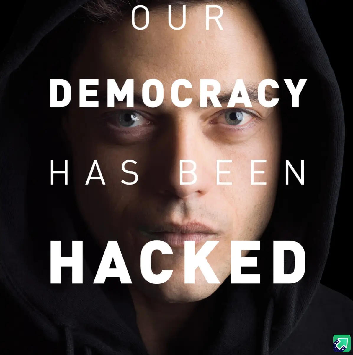 A close-up image of a man wearing a black hoodie, looking intensely at the camera with a serious expression. White bold text…