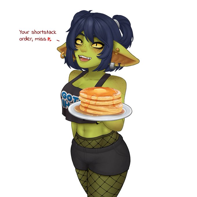 A green-skinned, elf-eared anime-style waitress with dark blue hair in pigtails holds a plate of pancakes topped with syrup…