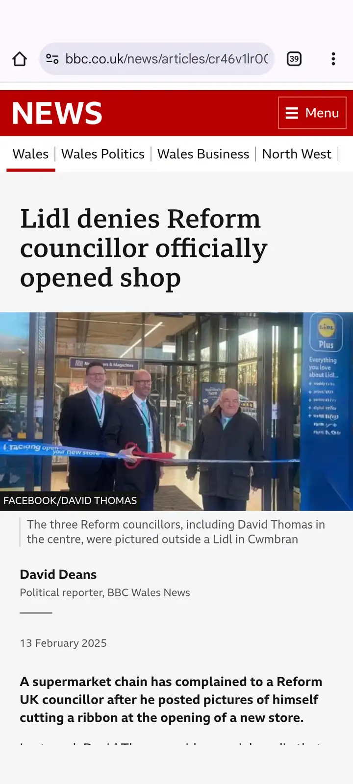 A screenshot of a BBC News article shows three men at a Lidl store ribbon-cutting event, with one man in the center holding…