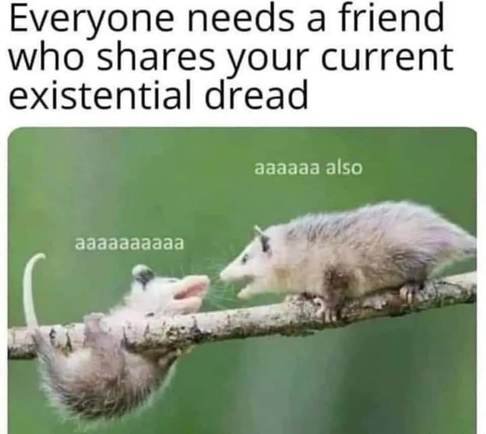 Two baby opossums are on a tree branch, one hanging upside down and both have their mouths open as if screaming. Text above…