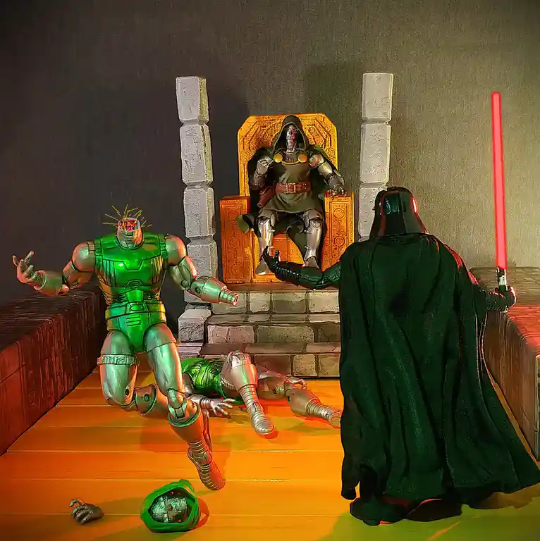A staged photo shows three action figures: a green-armored robot with its head exploding and limbs scattered on the floor, a…