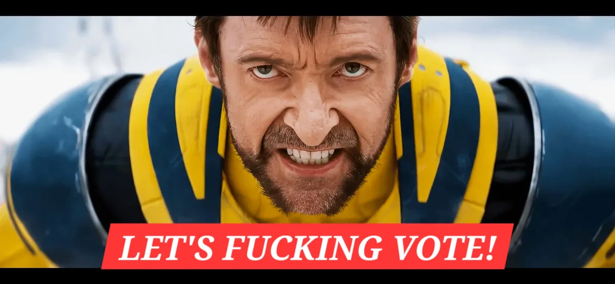 A close-up of Hugh Jackman as Wolverine in his iconic blue and yellow X-Men costume, snarling aggressively with bared teeth…