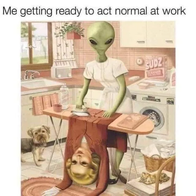 An alien in a white dress stands at an ironing board in a retro kitchen, ironing a shirt that has a human face upside down…