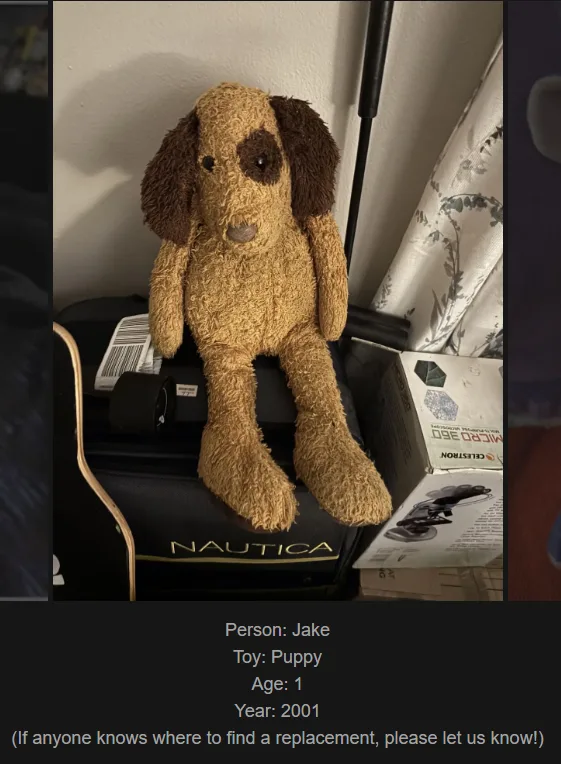 A brown, fluffy stuffed puppy toy sits on a black Nautica suitcase. The toy has floppy brown ears and a small brown patch…