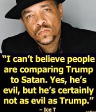 A close-up photo of Ice T wearing a black fedora and black shirt, looking directly at the camera with a serious expression…