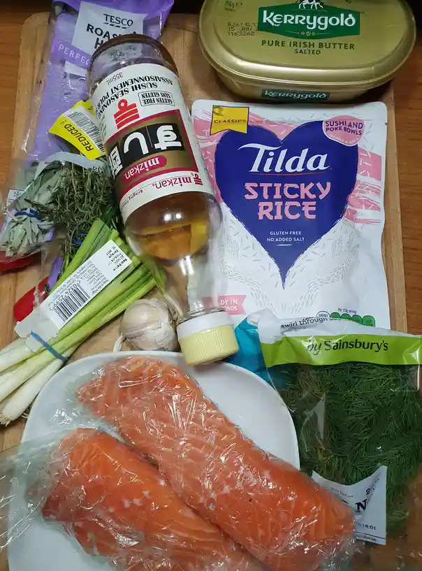 Pan-fried salmon fillets served with rice and a side of curiosity