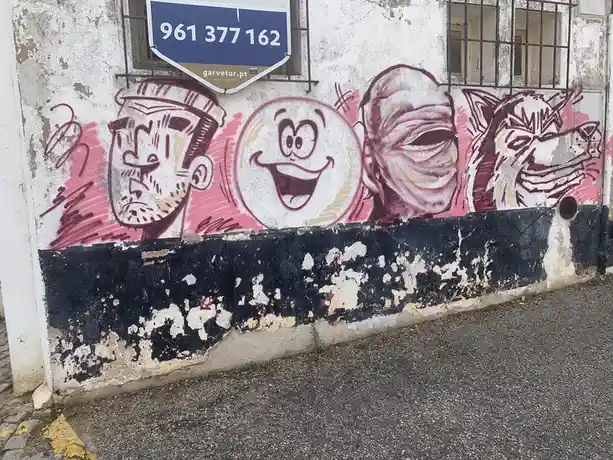 Faces of the vibrant street art scene in Lagos, Portugal.