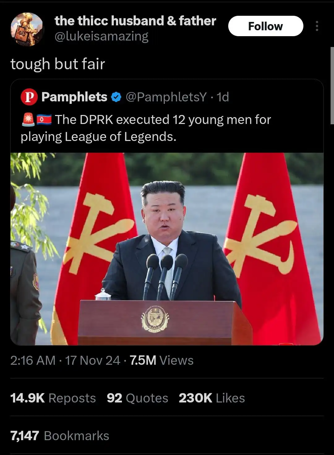 A screenshot of a social media post shows a man in a suit standing at a podium with two red flags featuring golden hammers…