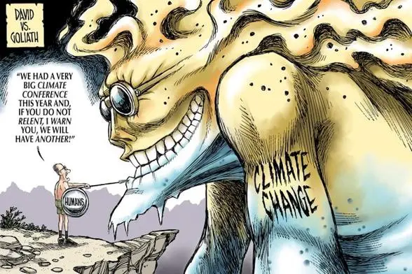 A giant, monstrous figure labeled 'CLIMATE CHANGE' looms over a tiny human holding a shield that reads 'HUMANS'. The giant…