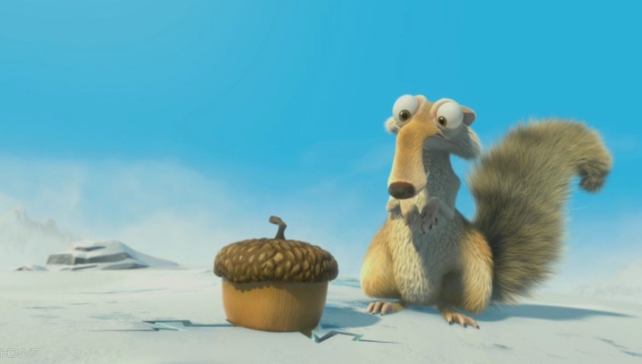 A cartoon squirrel with wide eyes and a bushy tail sits in a snowy landscape, staring at a large acorn beside it. The image…