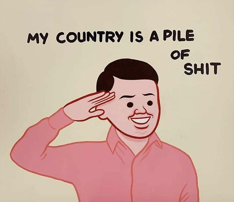 A cartoon man in a pink shirt salutes with a wide, forced smile while the text above him reads 'MY COUNTRY IS A PILE OF…