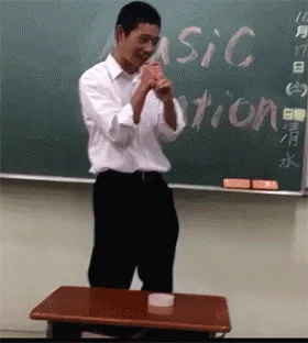 A sequence of six images shows a man in a white shirt and black pants initially standing at a desk in front of a chalkboard…