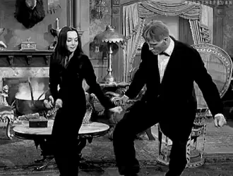 six black-and-white stills from a vintage film show a man and woman in formal wear dancing in an ornate room. The man is…