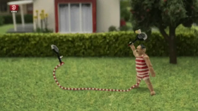A sequence of six panels shows a miniature man in a red-and-white striped swimsuit walking across a lawn while holding a…
