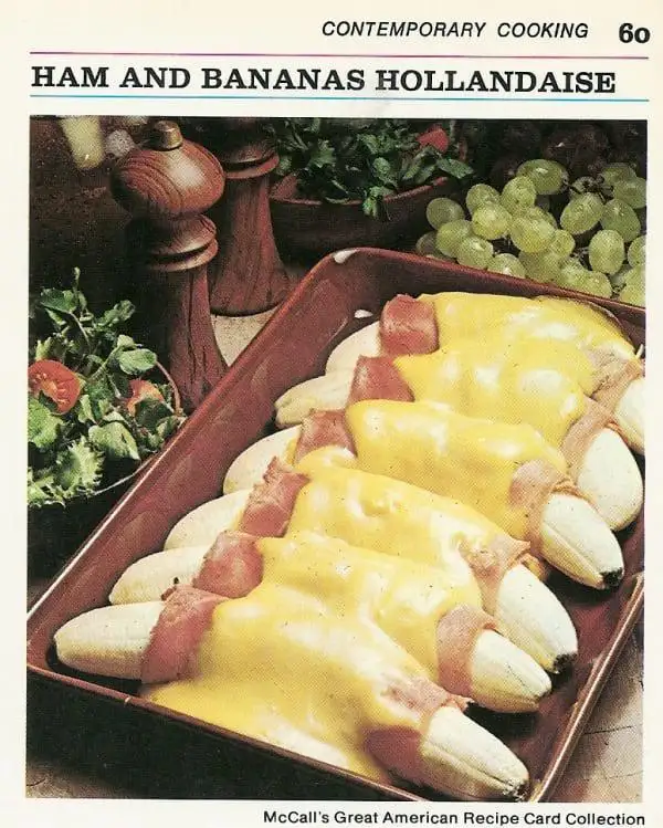 A vintage recipe card image from 'Contemporary Cooking' shows a baking tray with bananas wrapped in ham and covered in a…