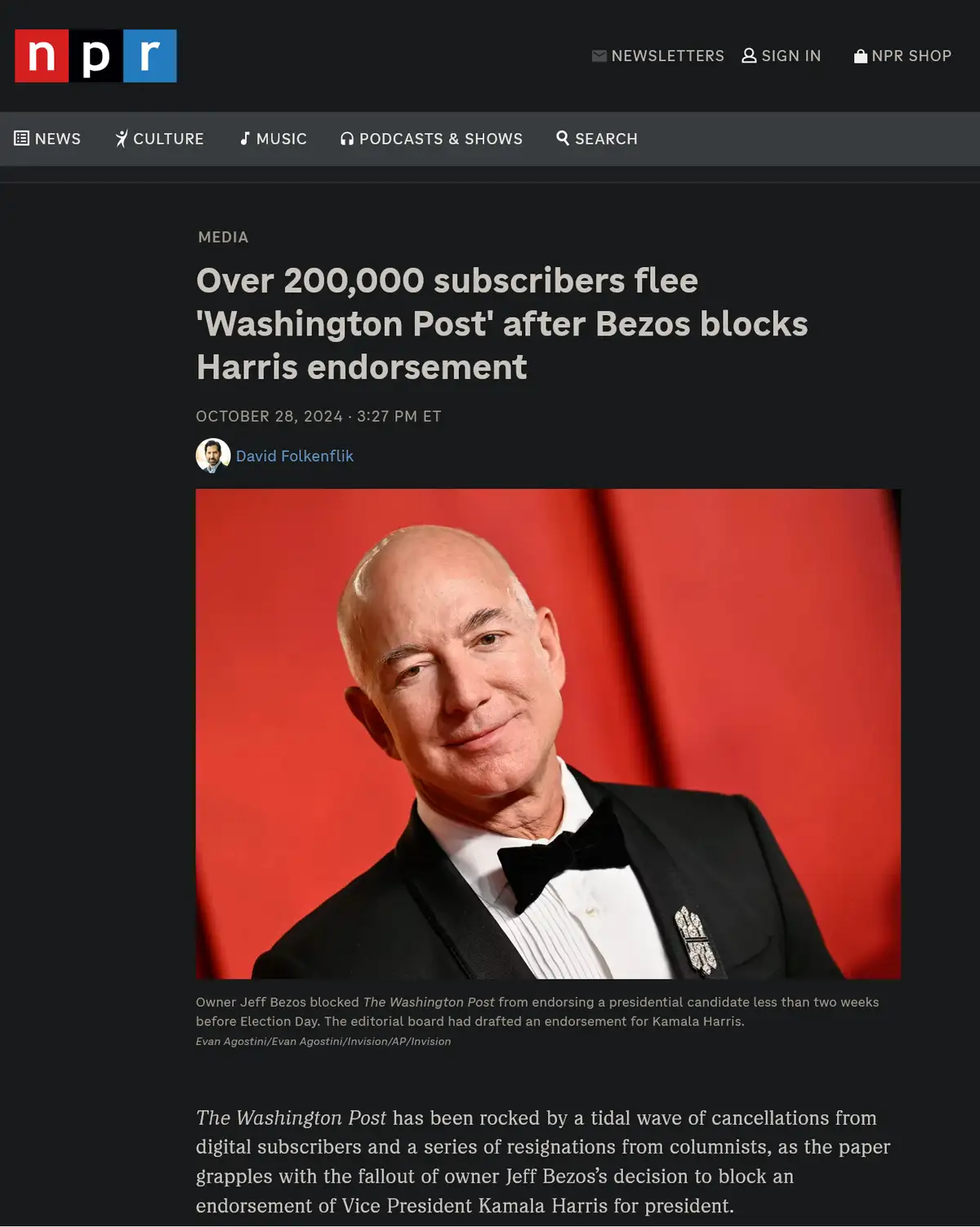A screenshot of an NPR news article shows a photo of Jeff Bezos in a tuxedo against a red background. The headline reads…