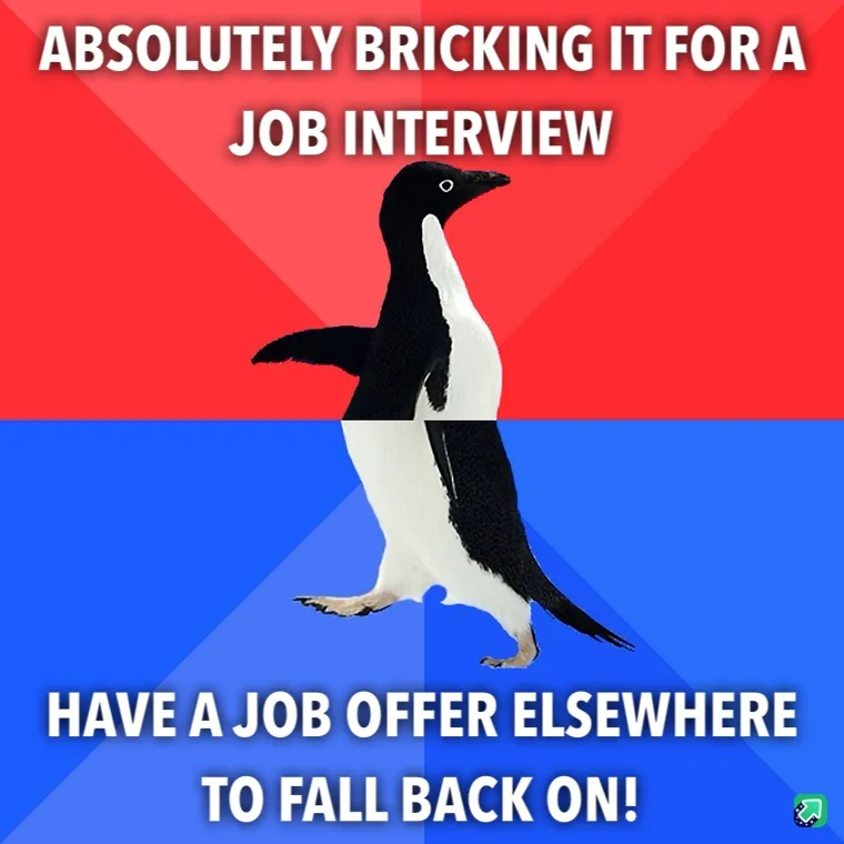 A penguin stands centered against a red and blue background, with white bold text at the top reading 'ABSOLUTELY BRICKING IT…