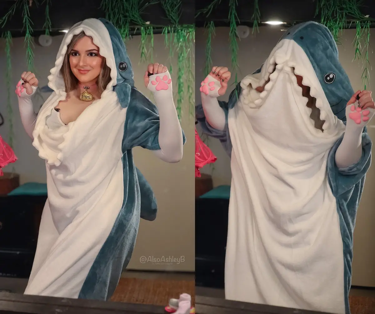 A split image shows a person in a shark-themed onesie. In the left panel, they smile with their face visible. In the right…