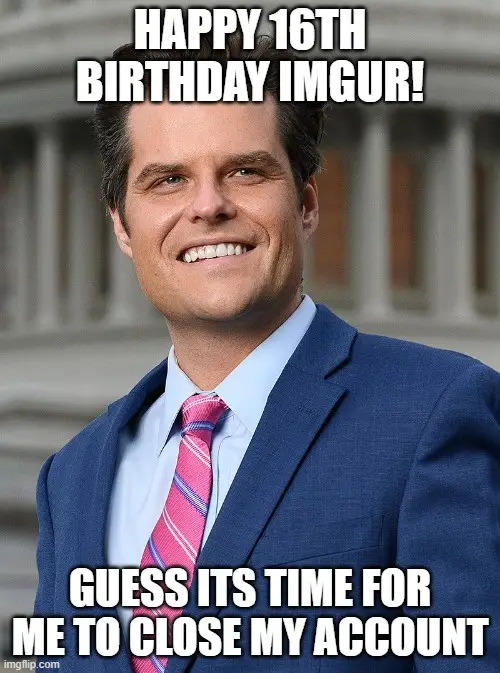 A man in a blue suit and pink striped tie smiles confidently while standing in front of a building. The text overlaid on the…