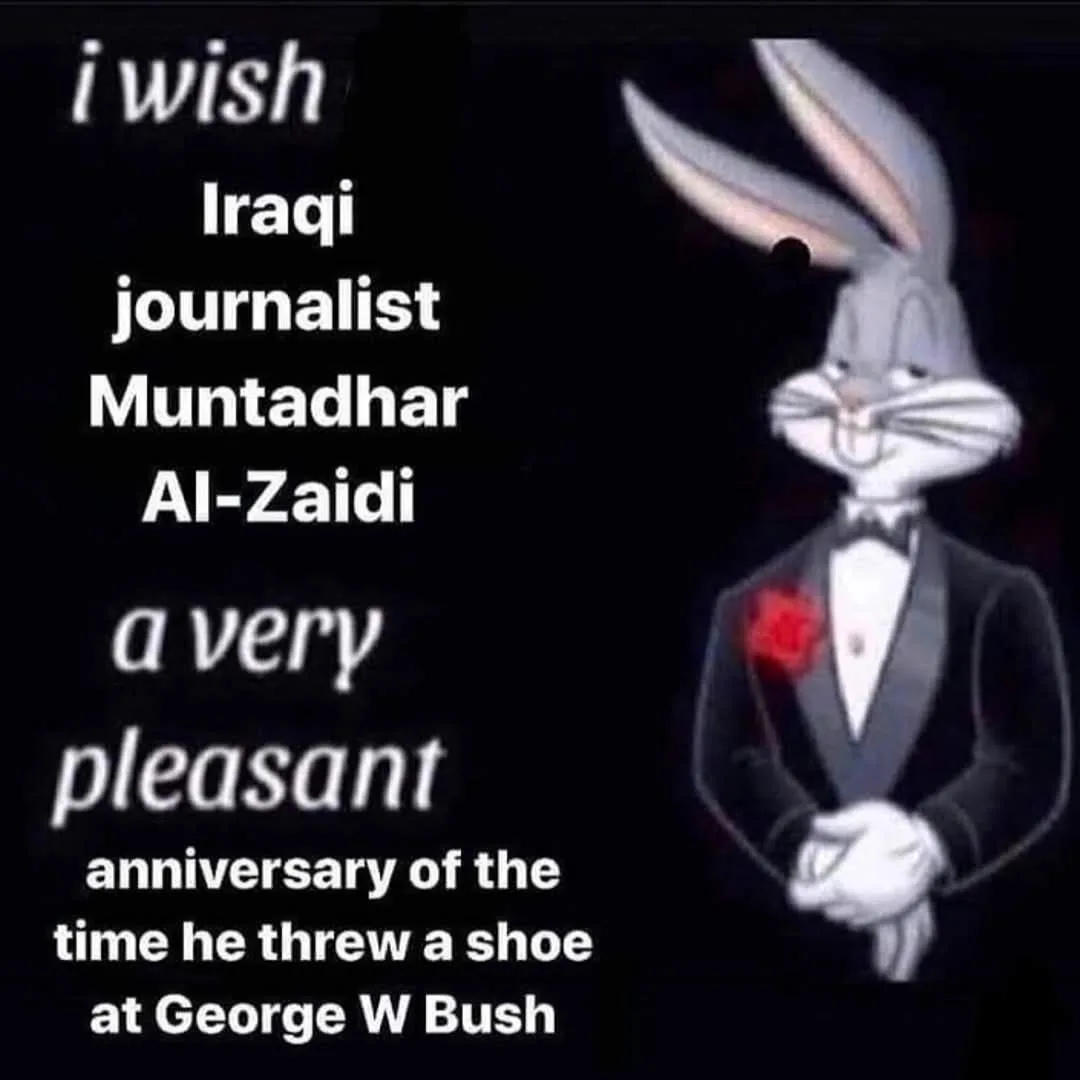 A cartoon image of Bugs Bunny dressed in a tuxedo with a red rose boutonniere, standing against a black background. White…