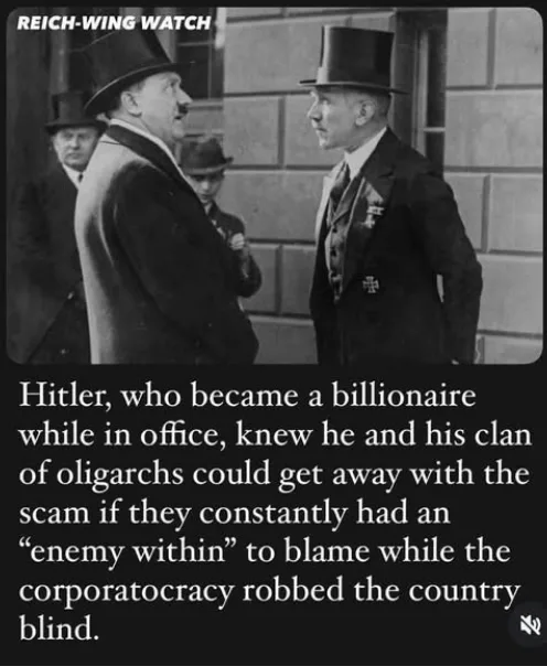 A black-and-white historical photograph shows Adolf Hitler in profile, facing another man in a top hat and suit, with other…